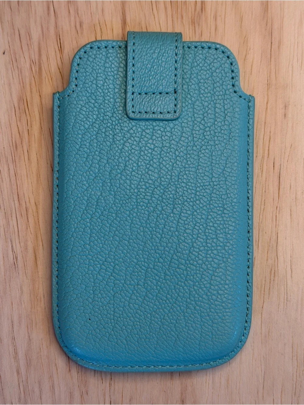 Tiffany & Co. turquoise pebbled leather phone sleeve with gold logo
